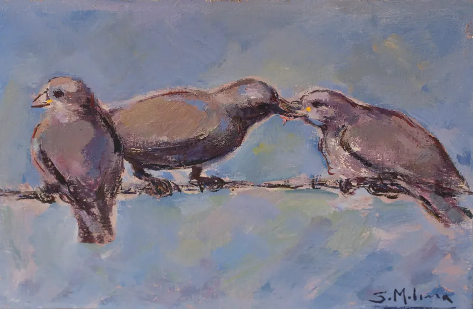 Tres pájaros en el alambre