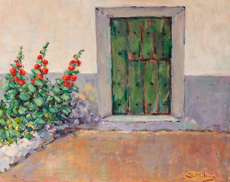 Flores rojas ante la puerta